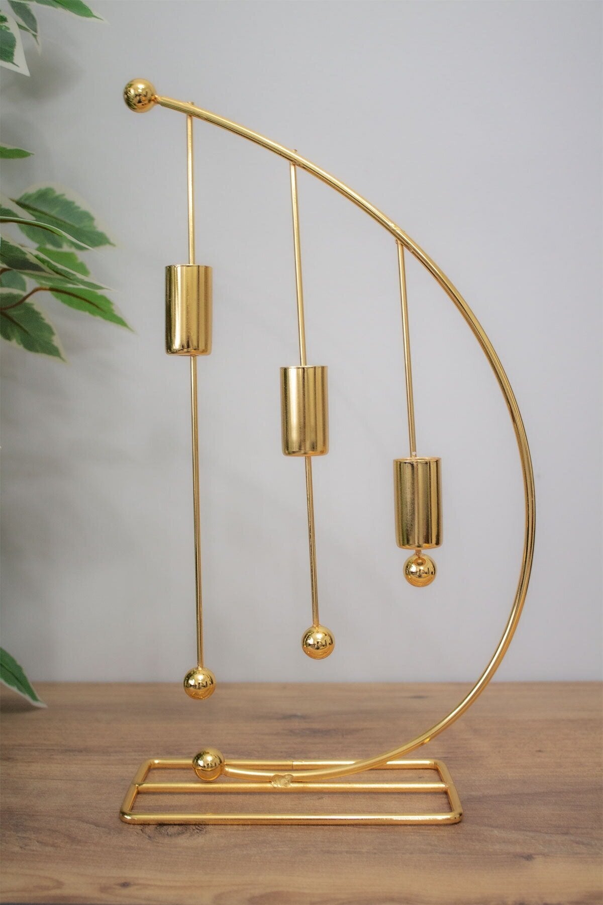 cresent moon kendle stand, moon shape candel holder gold, room decoration itemes metallic
half moon candlestick pakestan, wholesal home decor products, luxury candelabra 3 holder
table center peace decoration pieces, fancy stand for mombatti chand, decorewholesale.com dropship portal