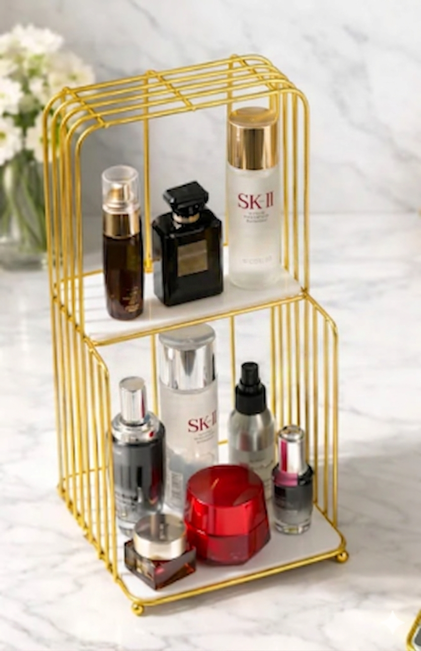 Gold metal Style Makeup Vanity Shelf holding cosmetics and luxury perfume bottles on a modern dressing table in Pakistan