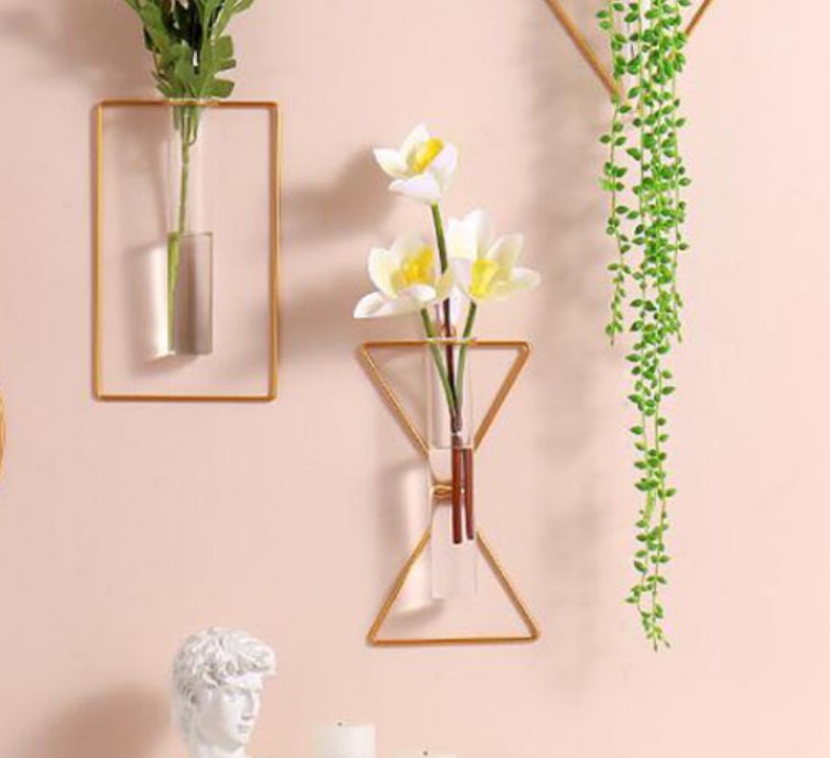Elegant gold metal wire wall vase for hydroponic plants and floral home interior styling.