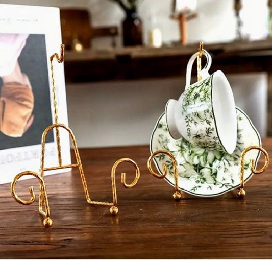 Antique gold Metal Vintage Tea Cup Display Stand holding premium porcelain cups and saucers in a glass cabinet in Pakistan decor wholesale
