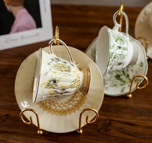 Antique gold Metal Vintage Tea Cup Display Stand holding premium porcelain cups and saucers in a glass cabinet in Pakistan decor wholesale