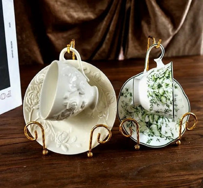 Antique gold Metal Vintage Tea Cup Display Stand holding premium porcelain cups and saucers in a glass cabinet in Pakistan decor wholesale
