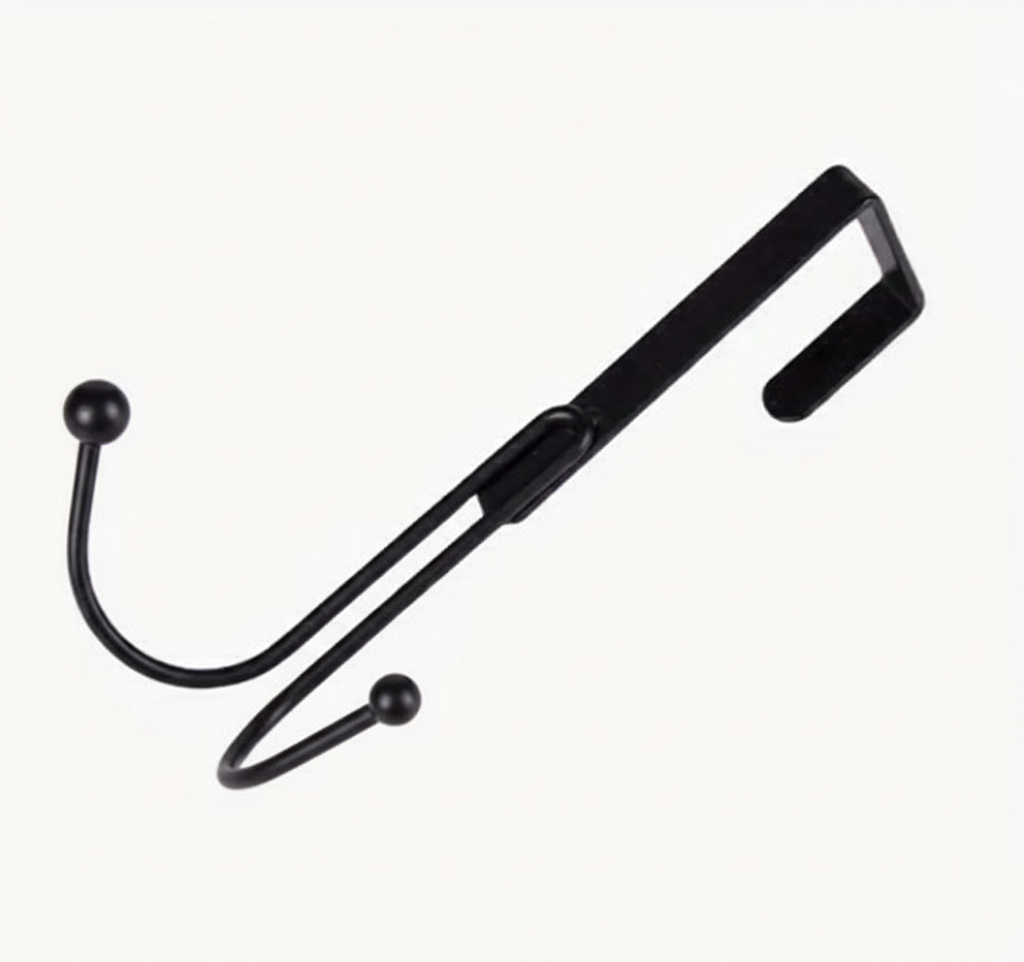 Sleek Metal Over the Door Hook Metal Double Head Hanger holding a backpack and a winter coat behind a bedroom door in Pakistan decore whole sale