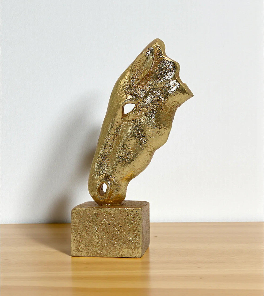 statue horse face golden small china 7.5x4 Price in Pakistan displayed over a modern living room console table