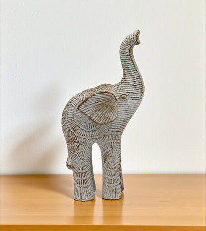 statue elephant sun up white china 7x3.6 Price in Pakistan displayed over an elegant glass table