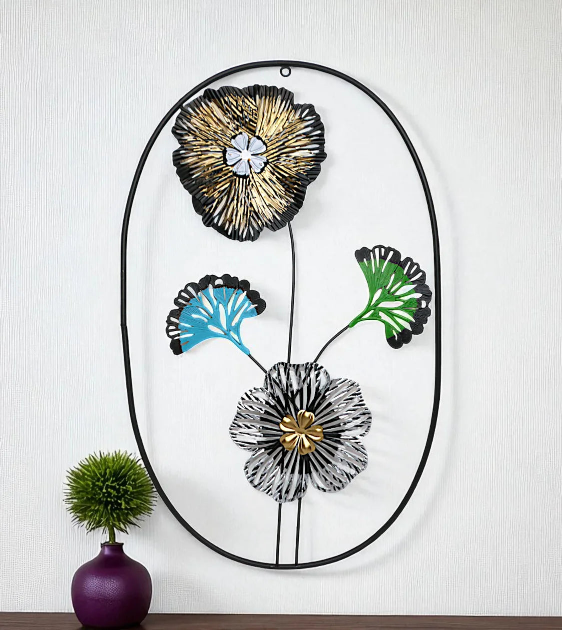 Metal Wall Hanging Floral Rectangle Black with premium oval leaf and flower art displayed on a drawing room wall in Pakistan