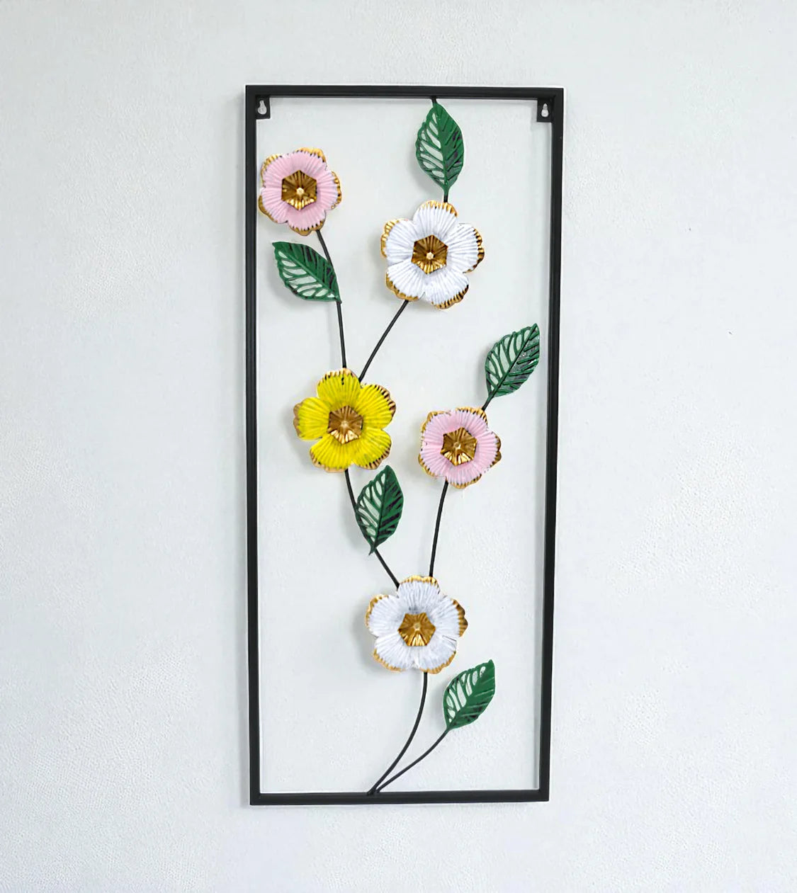 Metal Wall Hanging Floral Rectangle Black with 5 multi tone flowers displayed on a drawing room wall price in Pakistan