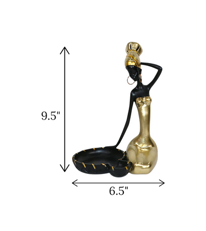 imported statue african girl and tray black and golden 9.5x6.5 Price in Pakistan displayed on a modern entrance console