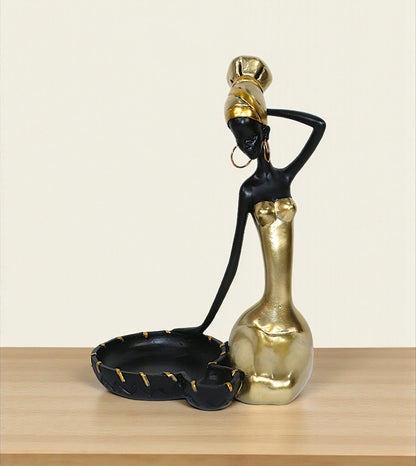 imported statue african girl and tray black and golden 9.5x6.5 Price in Pakistan displayed on a modern entrance console