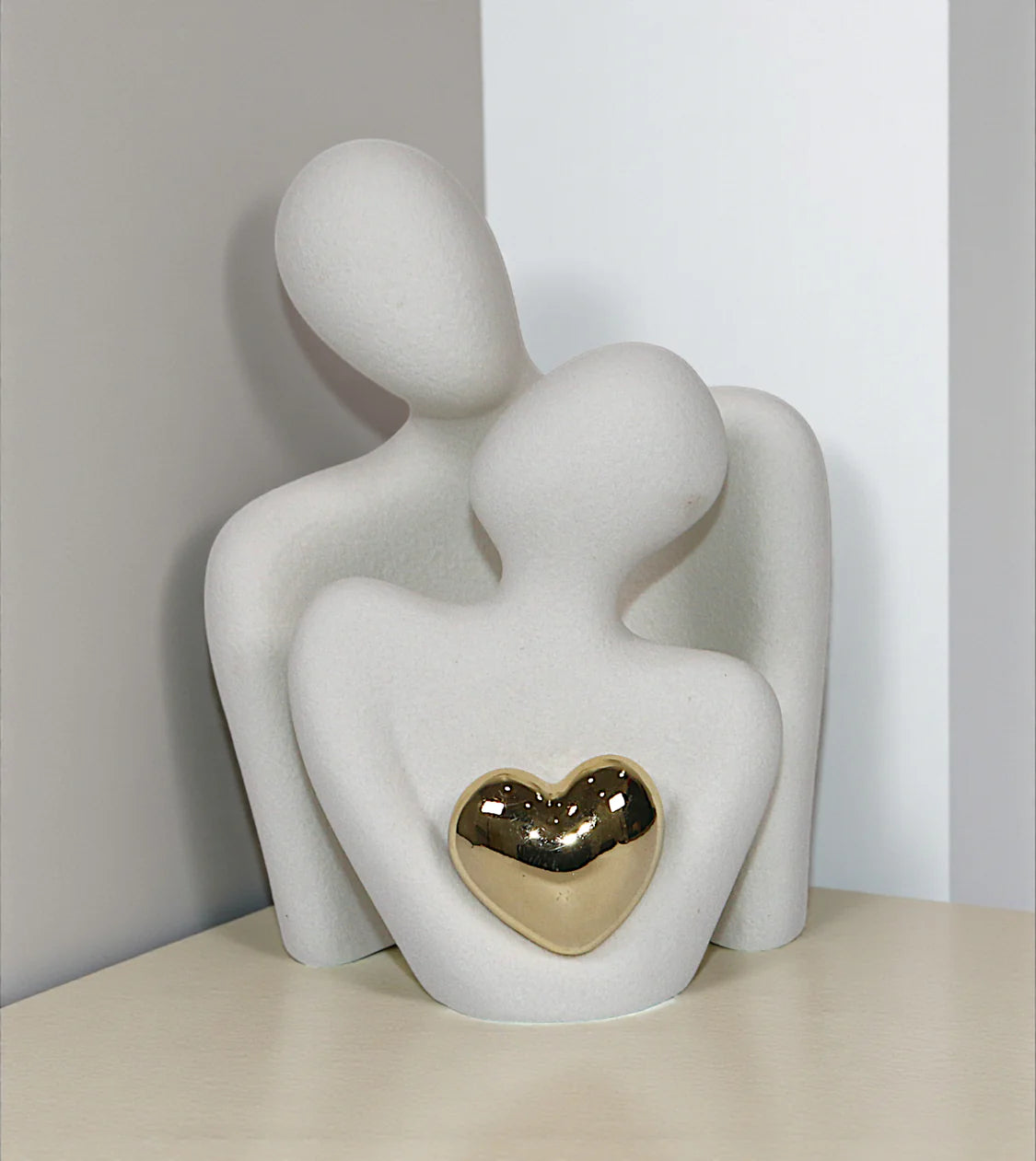 imported statue climbing stair and sit on stairs golden 9.6x6.5 Price in Pakistan placed over a drawing room centerpiece table