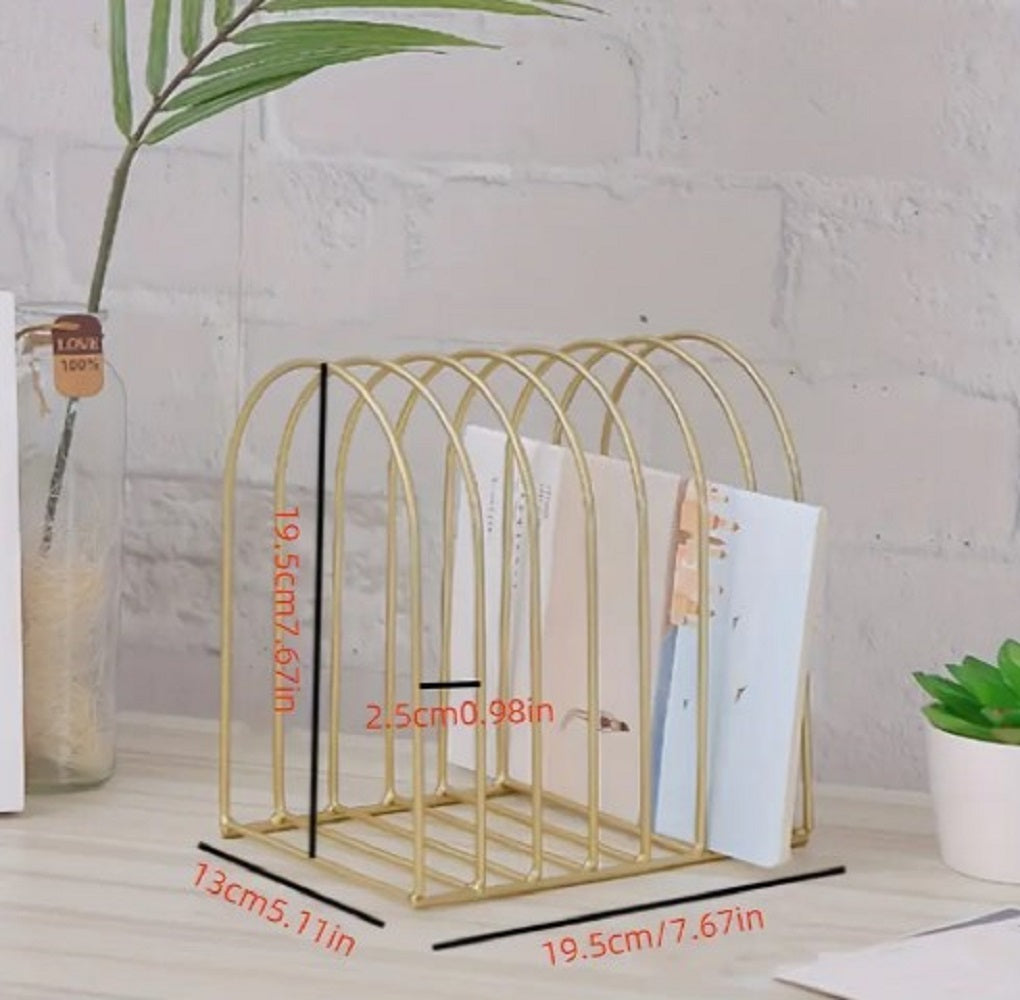Freestanding Iron Organizer metal wire rack holding books and colorful winter caps on a table in Pakistan