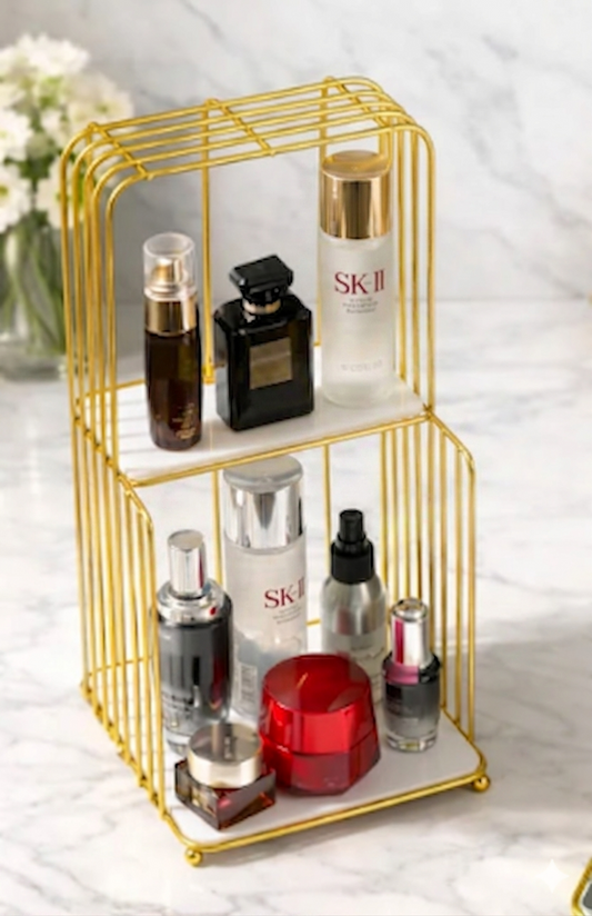 Gold metal Style Makeup Vanity Shelf holding cosmetics and luxury perfume bottles on a modern dressing table in Pakistan