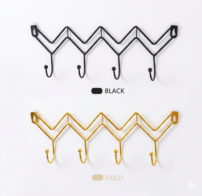 Comparison of black and gold zig-zag metal wall hooks for stylish home and office storage.