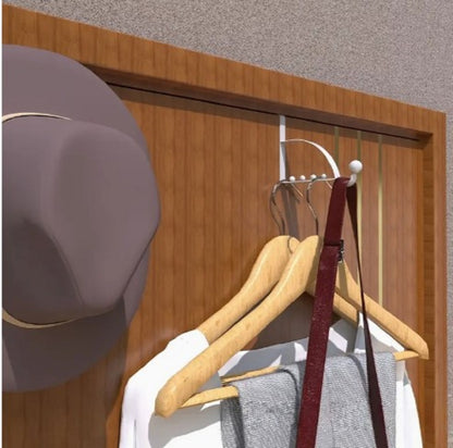 Black metal Over-the-Door Coat Rack with non-slip hooks hanging jackets and bags behind a bedroom door in Pakistan