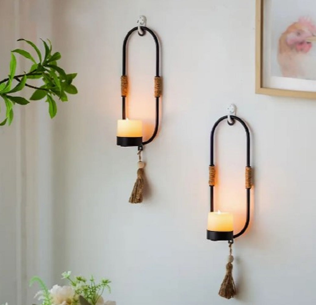 Luxury metal Wall Hanging Candle Holder with shiny gold finish hanging on a modern living room pyari wall in Pakistan