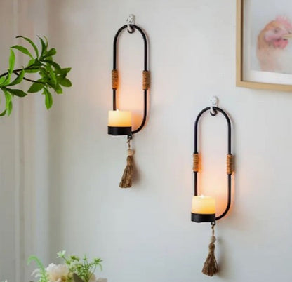 Luxury metal Wall Hanging Candle Holder with shiny gold finish hanging on a modern living room pyari wall in Pakistan
