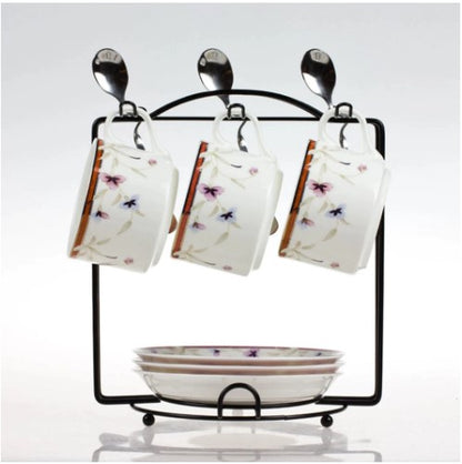 Cup holder stand, kitchen mug rack, tea set organizer, metal cup stand, saucer rack holder, coffee mug hanger, kitchen counter organizer, black metal rack, tea cup display, dining table accessories, spoon holder rack, space saving kitchen, durable cup stand, home decor kitchen, tea set stand, minimalist mug holder, metal wire rack, cup and saucer stand, kitchen storage solutions, stylish tea rack.