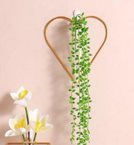 Premium heart shape gold wall vase with hanging green plants - Romantic home decor Pakistan.