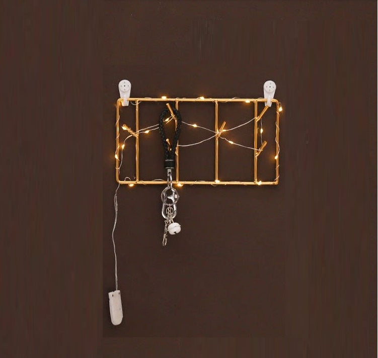 Rectangular and circular gold metal wall hooks for stylish home decor and key storage