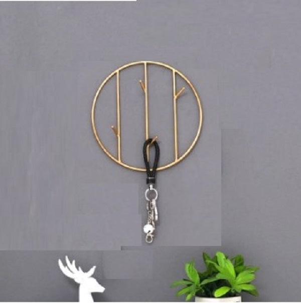 Luxury gold circle metal key holder wall hook with artistic branch design - Modern entryway decor Pakistan.