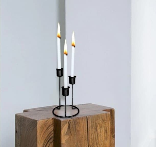 Black candle holder, 3 arm candelabra, metal candle stand, minimalist home decor, nordic style candle holder, dining table centerpiece, matte black candelabra, tapered candle stand, modern candle decor, wedding table decoration, living room accessories, iron candle holder, sleek metal stand, decorative candle pedestal, evening ambiance decor, stylish candelabra, candle arrangement, interior styling stand, black iron decor, luxury candle holder.