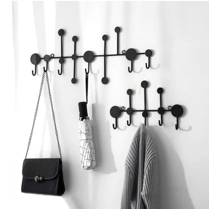 Modern black dot design wall hanging rack with handbags and scarves - Entryway and bedroom storage solution.