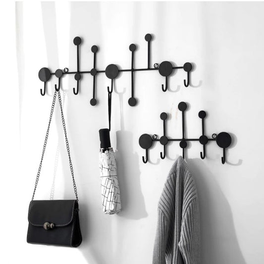 Modern black dot design wall hanging rack with handbags and scarves - Entryway and bedroom storage solution.