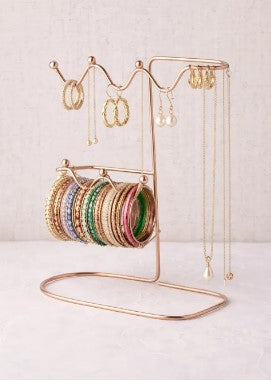 Elegant metal jewelry organizer stand with space for earrings and necklaces, perfect for vanity table storage and display.