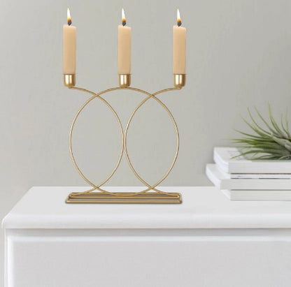 Taper candlestick holder

Glossy gold plated finish

3-arm and 5-arm candelabra

Event management decor accessories

Floral arrangement table stand

Hanging crystal drops design

Vintage style brass candle stand

Premium iron metal structure

Dinner table centerpiece layout

Shadi event entrance decoration