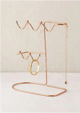 Elegant metal jewelry organizer stand for earrings and necklaces, perfect for vanity tables and keeping accessories organized.