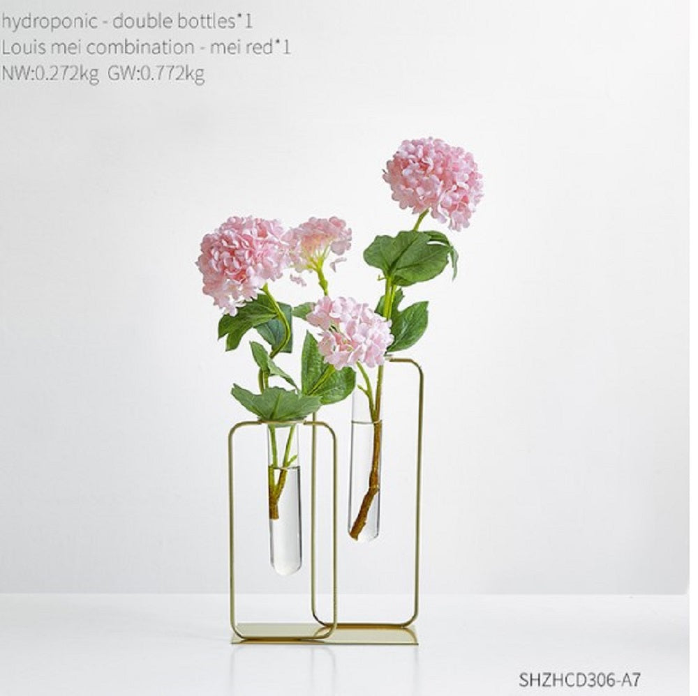 Elegant gold metal frame hydroponic vase with two glass bottles and pink flowers - Luxury home decor Pakistan