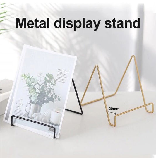 Metal display stand, gold plate holder, black iron easel, decorative book stand, tabletop picture frame holder, modern home decor, minimalist office organizer, luxury stationery, wholesale price metal stand, best price display holder, dropshipping products Pakistan, Nordic style decor, wedding card holder, recipe book stand, iron wire stand, gold finish easel, black matte stand, desktop accessory, premium display rack, small plate stand, showroom display tools, durable metal frame.