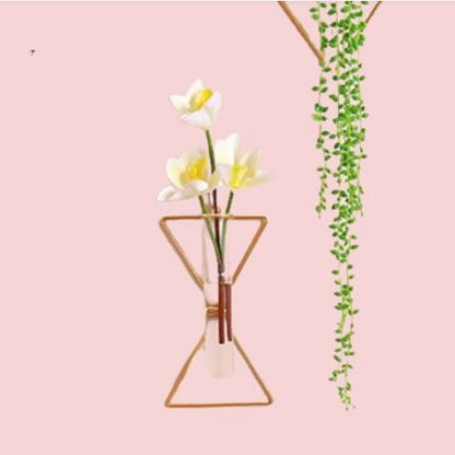 Modern wall-mounted gold triangle metal vase with glass tube and white flowers - Aesthetic wall decor Pakistan