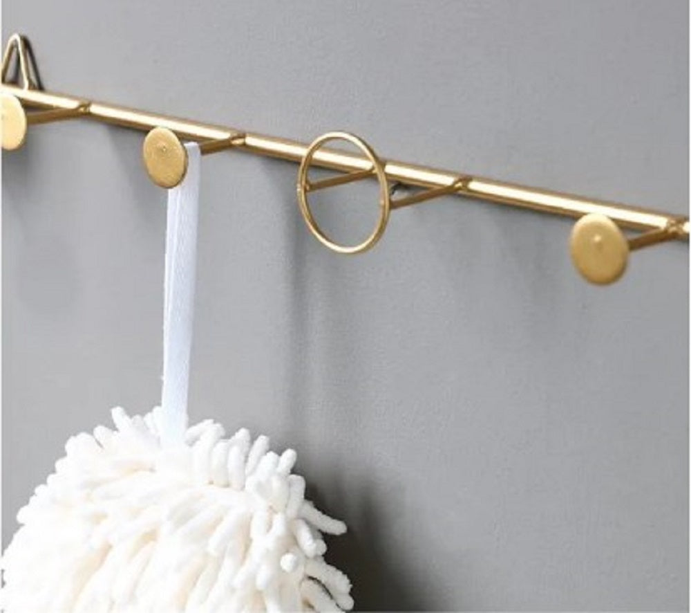 Luxury gold wall rail with circular hooks for bathroom towels and accessories - Modern home decor Pakistan.