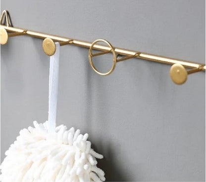 Luxury gold wall rail with circular hooks for bathroom towels and accessories - Modern home decor Pakistan.