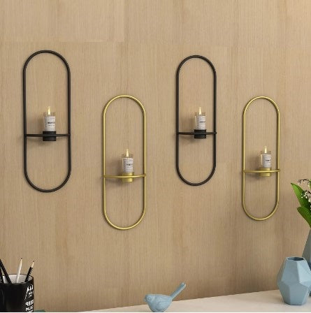 Nordic style oval metal wall-mounted candle holders in black and gold for a luxurious living room atmosphere.