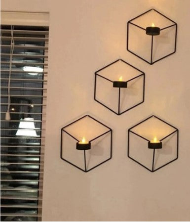 Modern black hexagonal 3D geometric wall candle holder set for artistic home interior and mood lighting.
