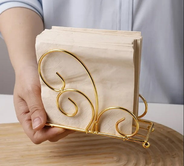 Black tissue stand, vertical napkin holder, metal tissue rack, wrought iron scroll holder, elegant dining table accessories, minimalist kitchen counter organizer, restaurant tabletop napkin server, matte black tissue dispenser, wedding catering buffet display, modern room tissue organizer, upright paper napkin frame, wire frame napkin cradle, dinner party tissue stand, boutique hotel tableware utilities, fancy tissue paper rack, black iron napkin basket, decorative table storage tray, home buffet server acc